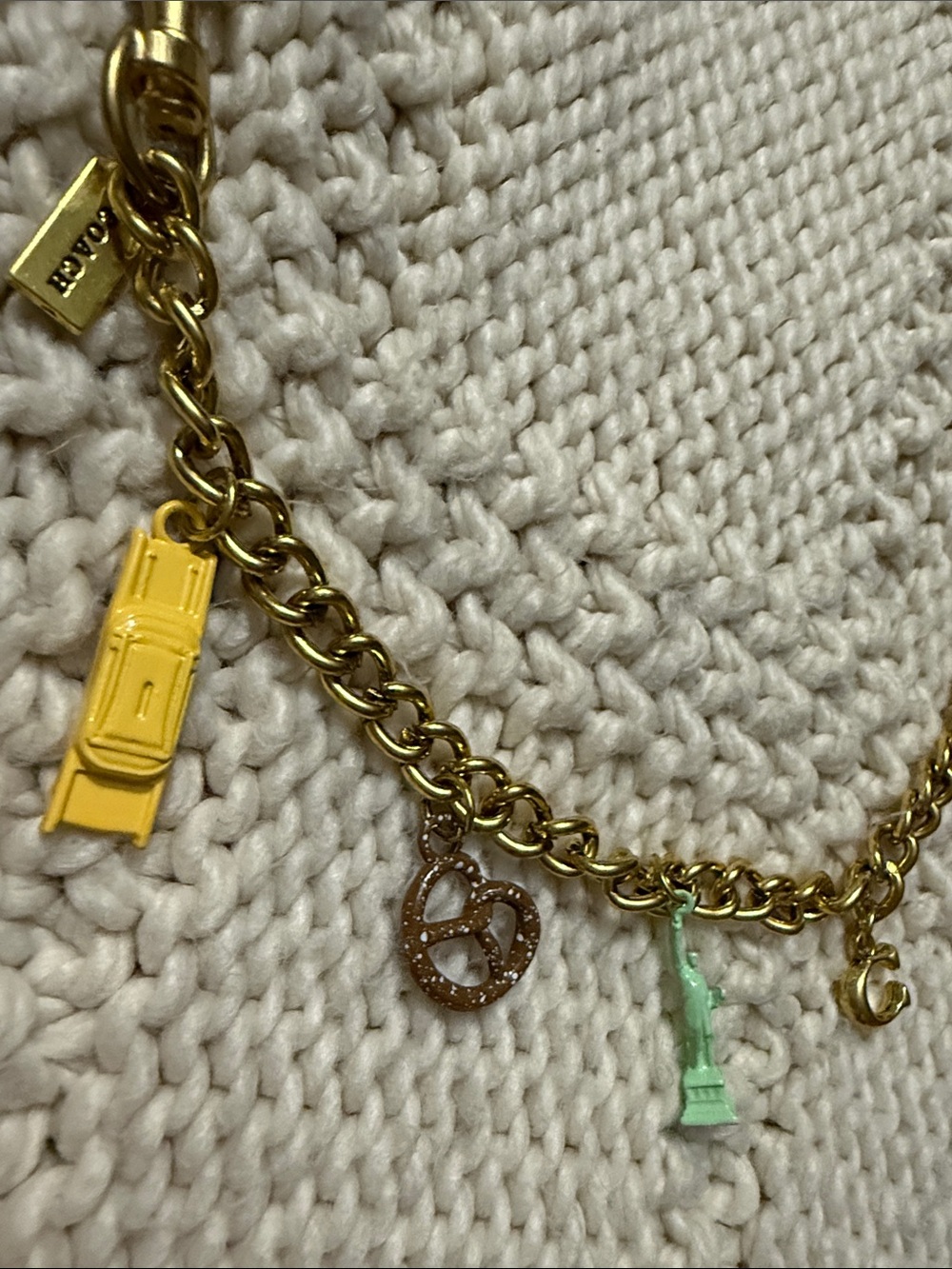 Coach Gold Charm Bracelet with Red, Yellow, Mint, and Rose-Gold Accents - Picture 4 of 6
